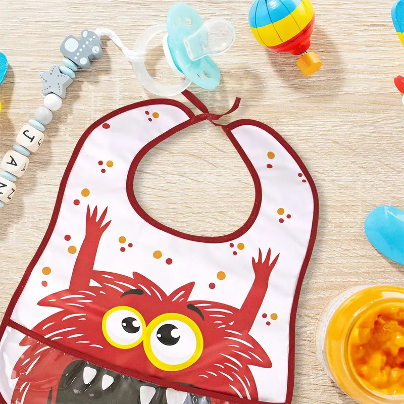 Babero Tipo Batita Con Bolsa Plastificada De Monstruo Rojo Para Bebé 2